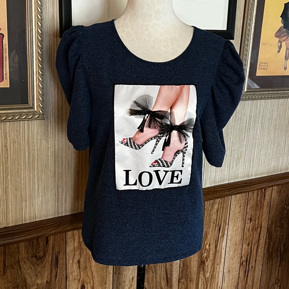 Love J top blue  with high heel shoe design with black bow trim . Size XL